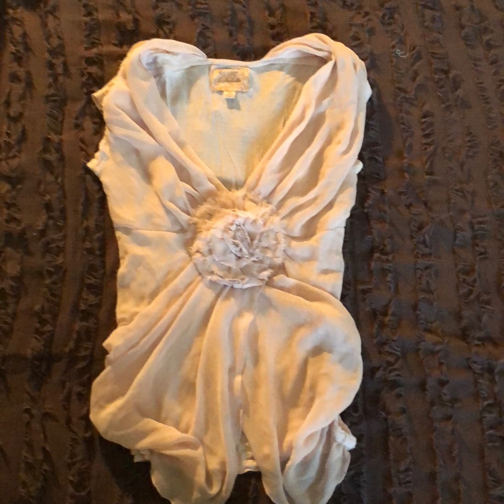 blush/cream top with large rose flower in center